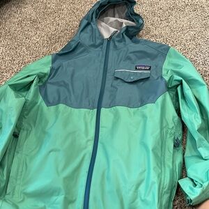 Like new. Youth size large Patagonia rain jacket